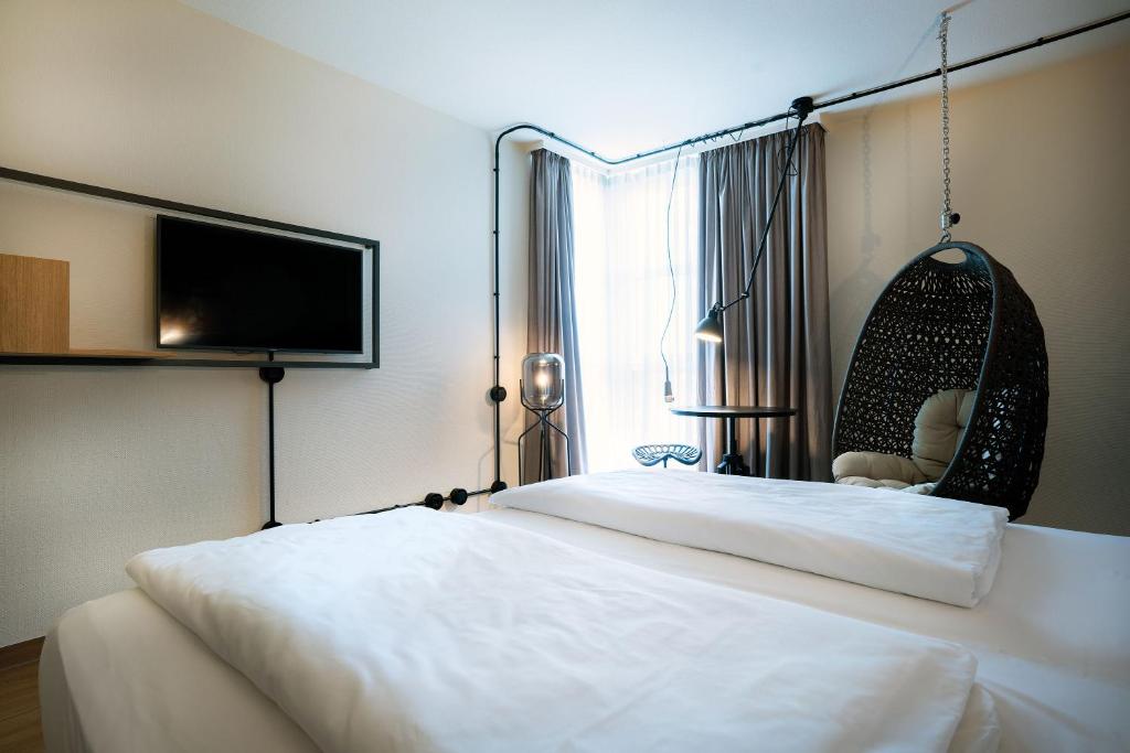 Postel nebo postele na pokoji v ubytování Seminaris Hotel Nürnberg