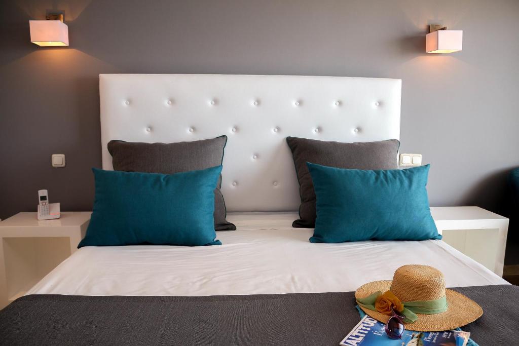 Postel nebo postele na pokoji v ubytování Hotel Byzance