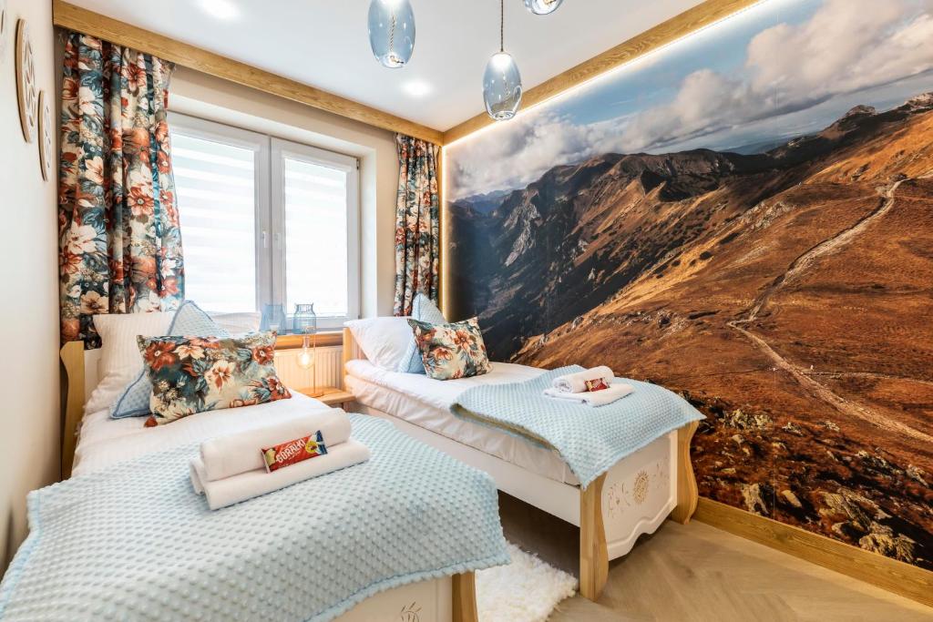 Posteľ alebo postele v izbe v ubytovaní Bunia w Zakopanem z jacuzzi