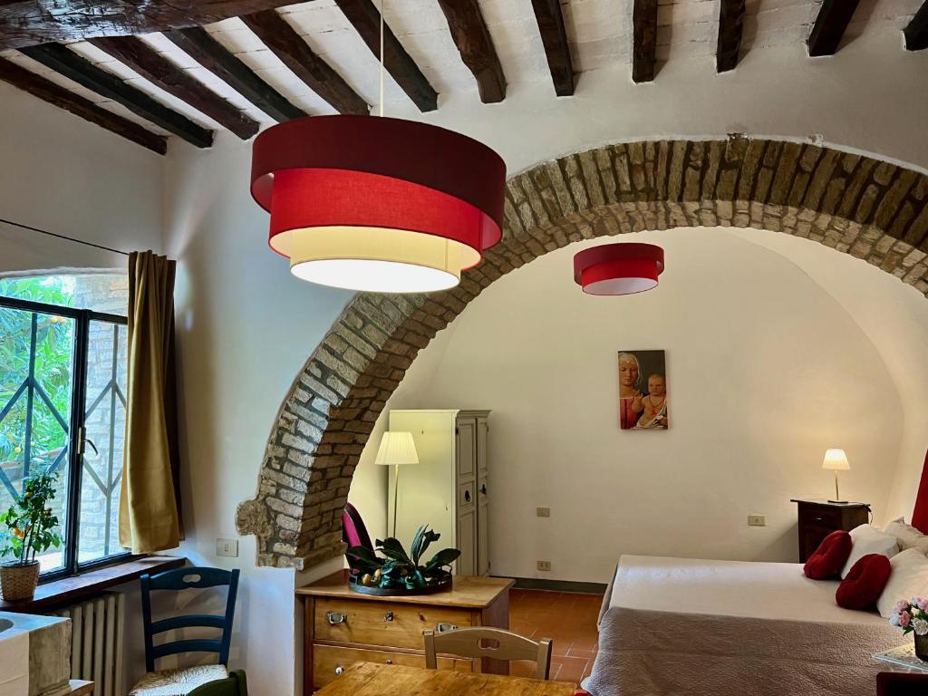 Postel nebo postele na pokoji v ubytování Le Fonti di San Gimignano