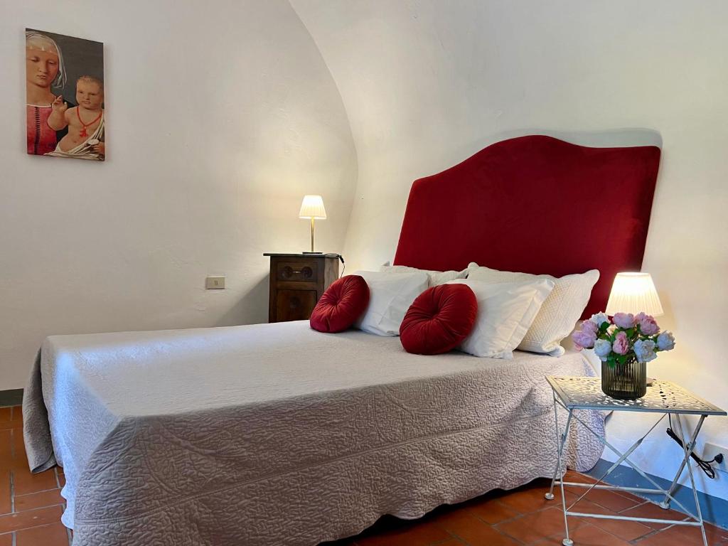 Postel nebo postele na pokoji v ubytování Le Fonti di San Gimignano