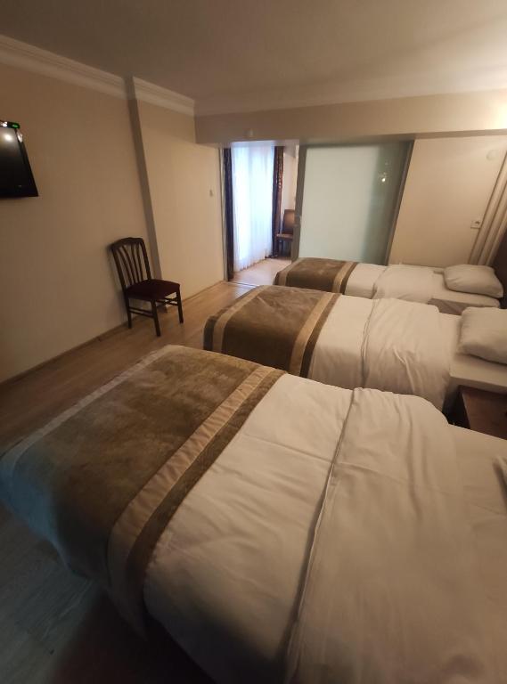 Postel nebo postele na pokoji v ubytování Hotel Akyildiz