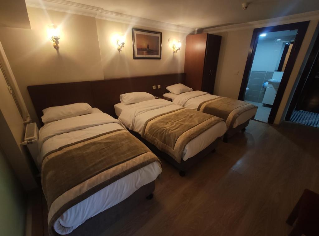 Postel nebo postele na pokoji v ubytování Hotel Akyildiz