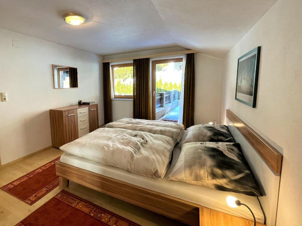 Postel nebo postele na pokoji v ubytování Apartment Fill by Interhome