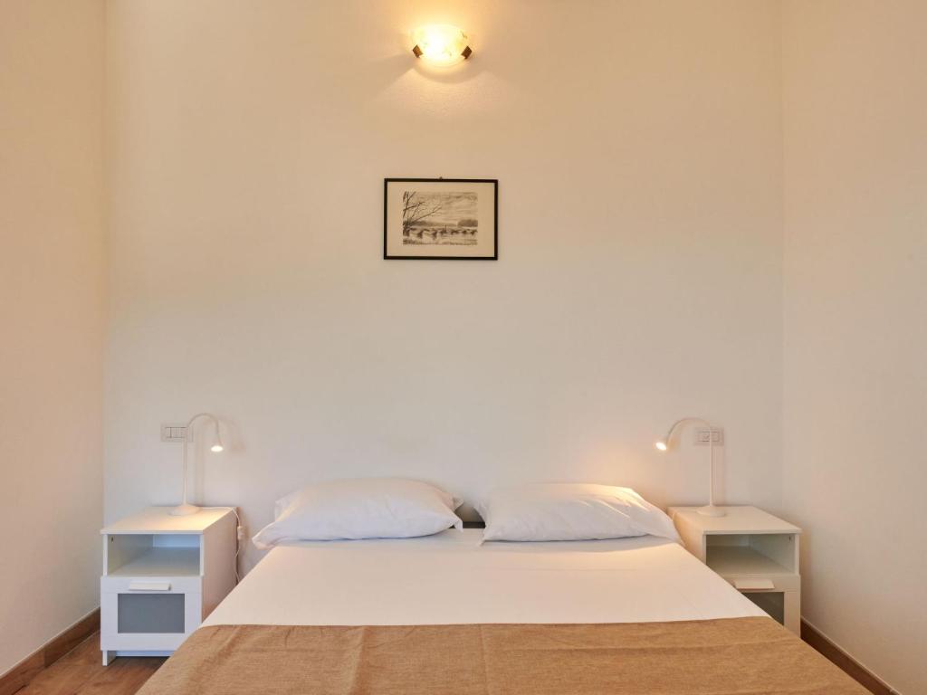 Postel nebo postele na pokoji v ubytování Apartment Minú by Interhome