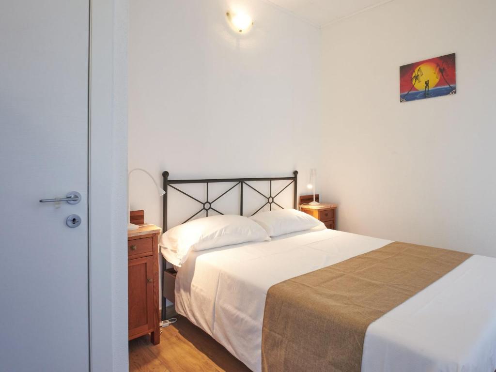 Postel nebo postele na pokoji v ubytování Apartment Minú by Interhome