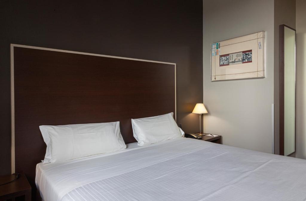 Postel nebo postele na pokoji v ubytování Art Hotel Olympic