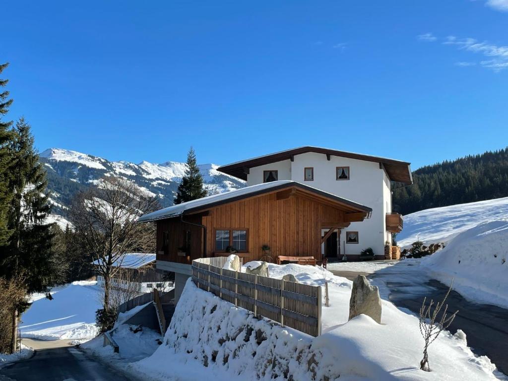 a house in the snow with a fence at Apartment Karwendel by Interhome in Oberau