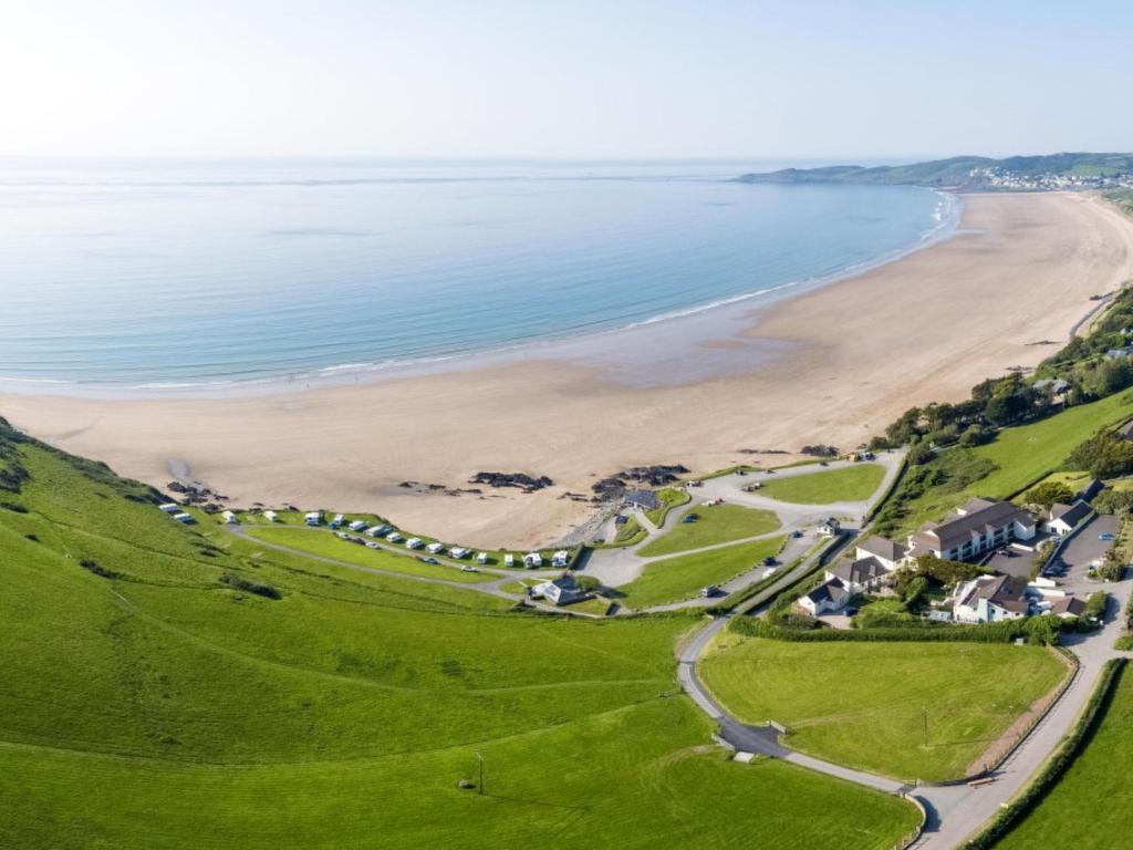 an aerial view of a beach and the ocean at Apartment Flat 11 Clifton Court by Interhome in Croyde
