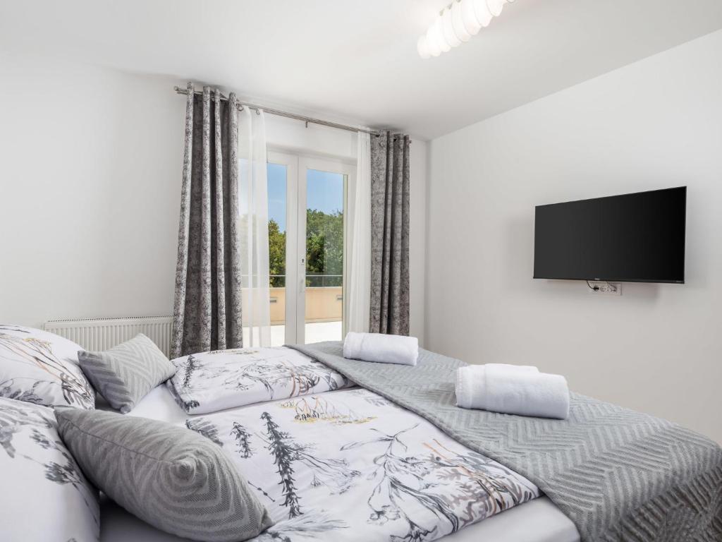 Postel nebo postele na pokoji v ubytování Villa Matea by Interhome