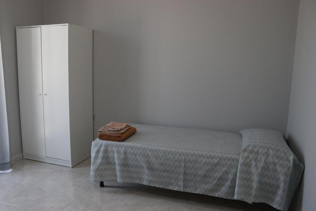 Postel nebo postele na pokoji v ubytování Casa degli Ulivi con parcheggio privato