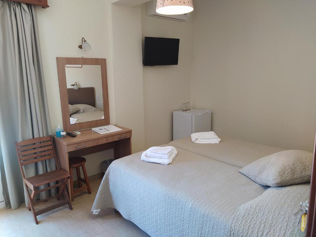 Postel nebo postele na pokoji v ubytování Ilios Hotel