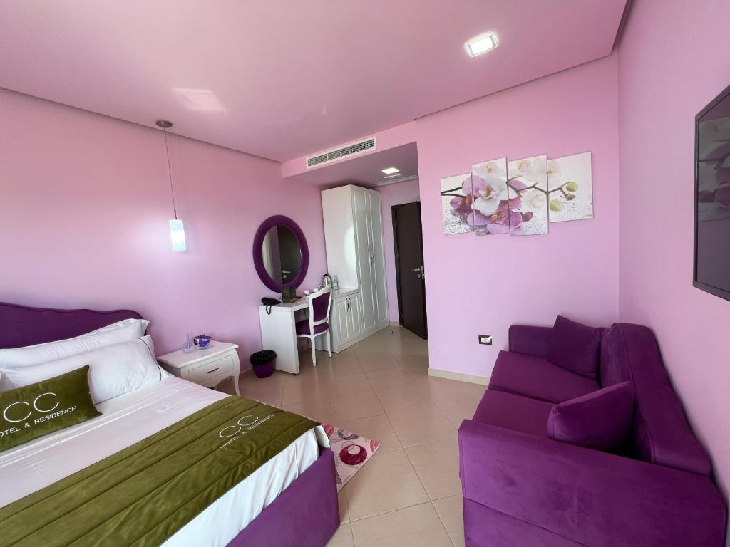 Postel nebo postele na pokoji v ubytování CC Hotel & Residence