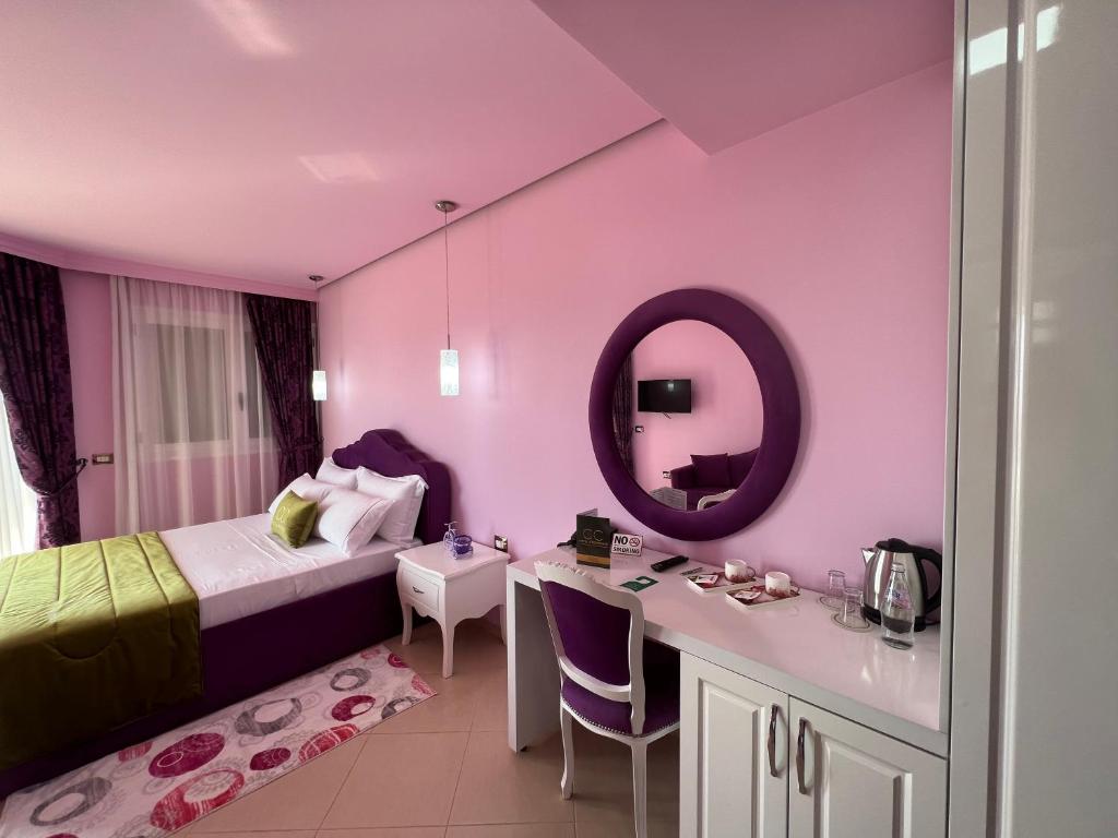 Postel nebo postele na pokoji v ubytování CC Hotel & Residence