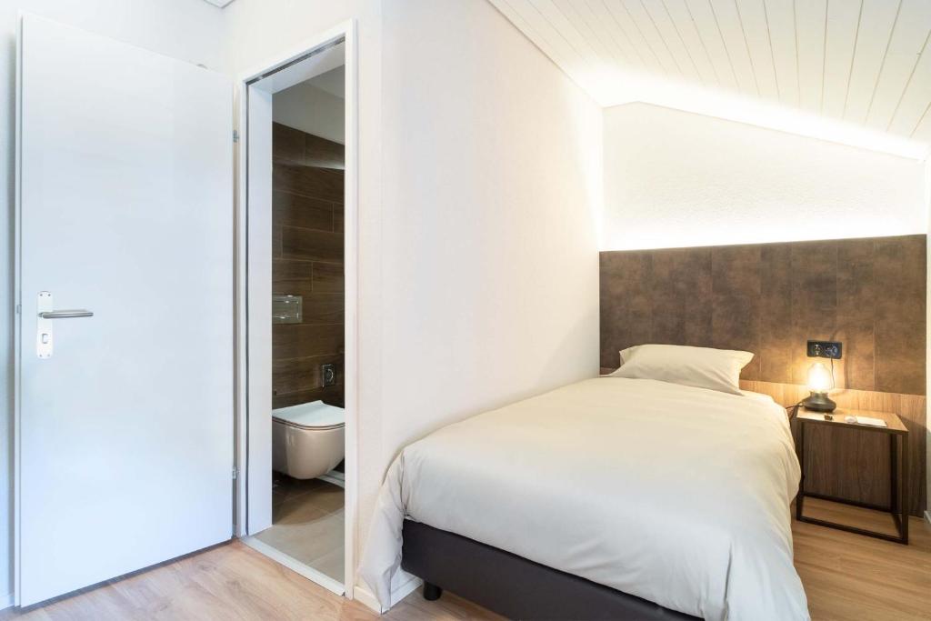 Postel nebo postele na pokoji v ubytování Relais Lucomagno