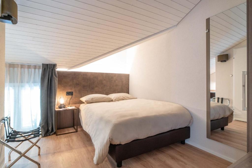 Postel nebo postele na pokoji v ubytování Relais Lucomagno