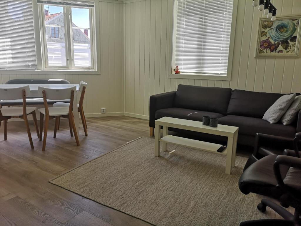 a living room with a couch and a table at New 2 bed room apartment in Halden in Halden
