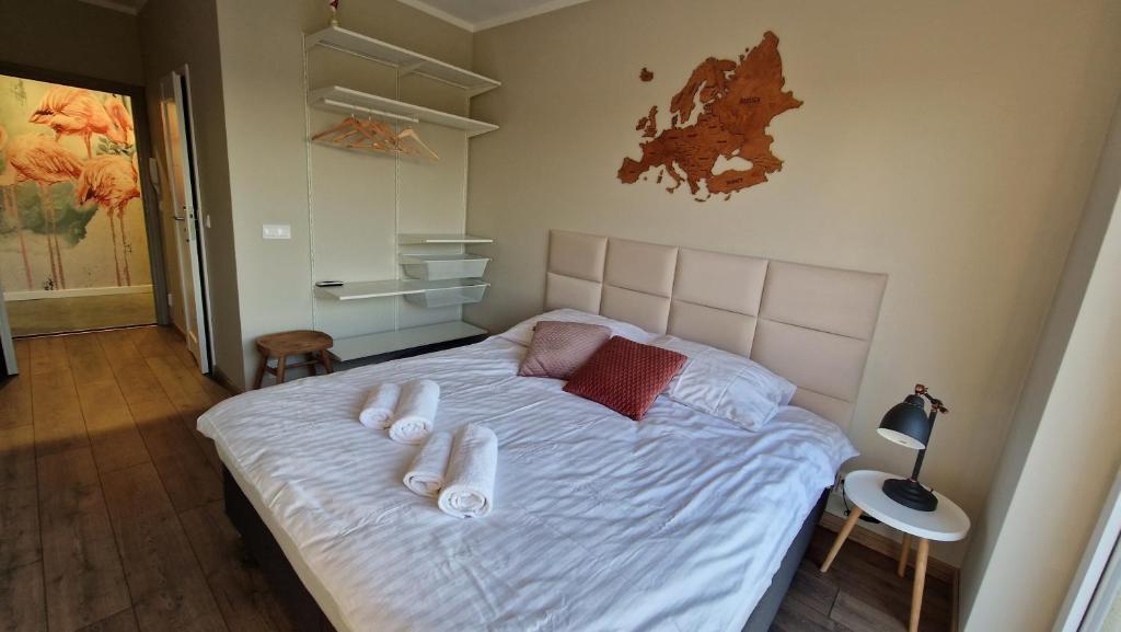 Łóżko lub łóżka w pokoju w obiekcie Apartament Golf & Nature - Na Polu Golfowym