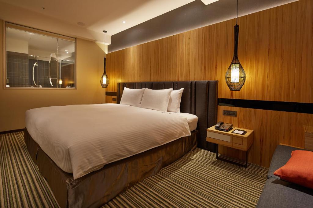Postel nebo postele na pokoji v ubytování La Vida Hotel