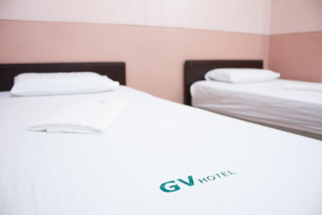 Postel nebo postele na pokoji v ubytování GV Hotel - Borongan