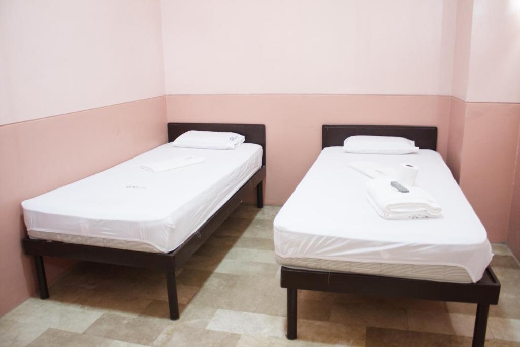 Postel nebo postele na pokoji v ubytování GV Hotel - Borongan
