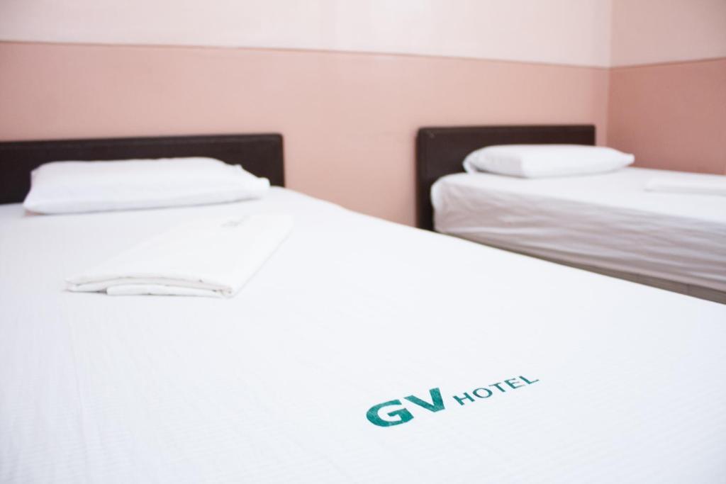 Postel nebo postele na pokoji v ubytování GV Hotel - Borongan