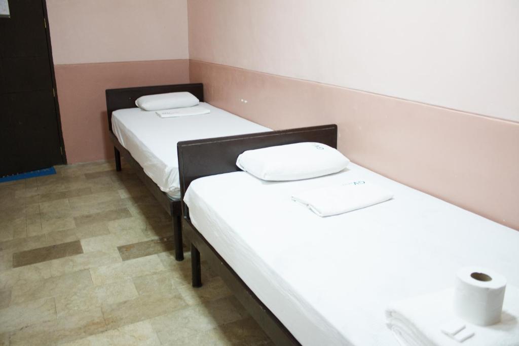 Postel nebo postele na pokoji v ubytování GV Hotel - Borongan