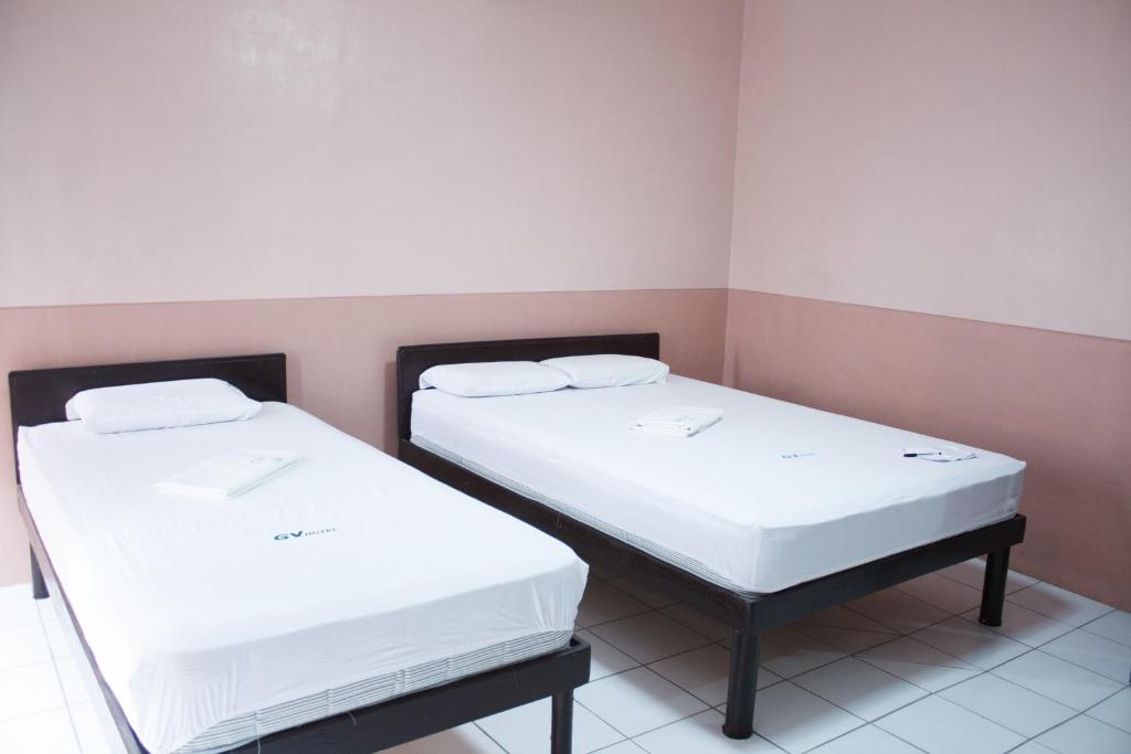 Postel nebo postele na pokoji v ubytování GV Hotel - Borongan