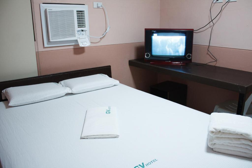 Postel nebo postele na pokoji v ubytování GV Hotel - Borongan