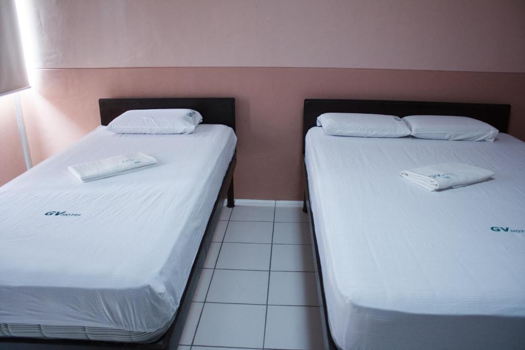 Postel nebo postele na pokoji v ubytování GV Hotel - Borongan