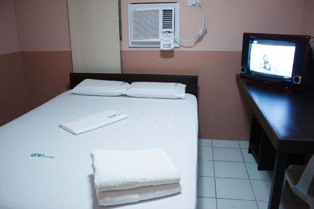 Postel nebo postele na pokoji v ubytování GV Hotel - Borongan
