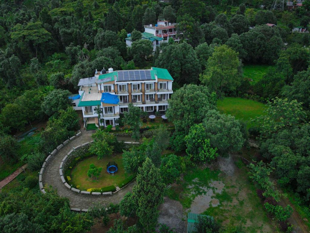 an aerial view of a large house in the forest at Chirping Hills Resort,Bhimtal in Bhīm Tāl