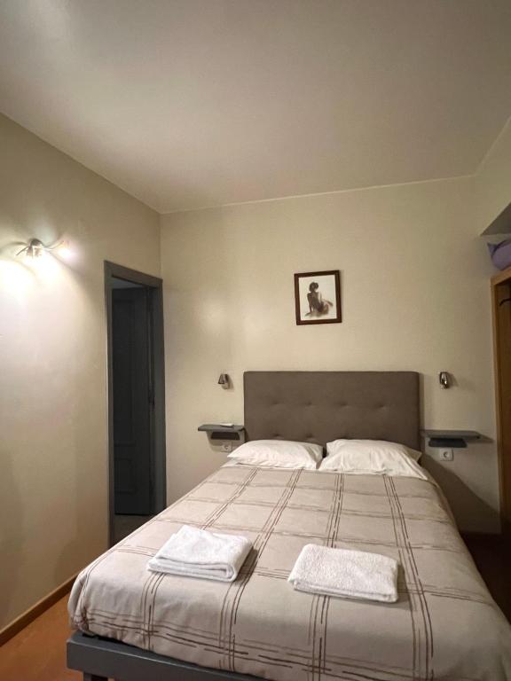 Postel nebo postele na pokoji v ubytování Abrigo do Portinho