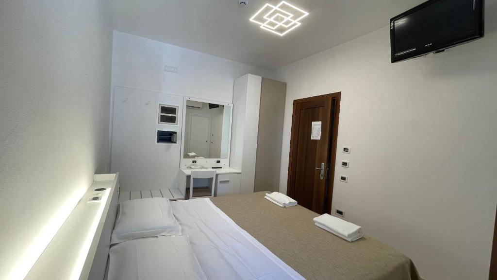 Postel nebo postele na pokoji v ubytování Hotel Boschetto