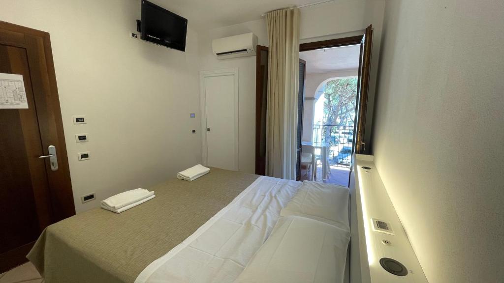 Postel nebo postele na pokoji v ubytování Hotel Boschetto