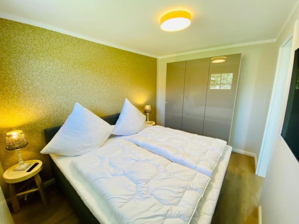 Postel nebo postele na pokoji v ubytování Ferienwohnung Sol im idyllischen Pruchten