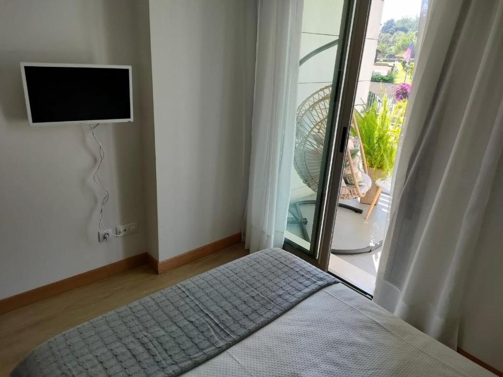 Postel nebo postele na pokoji v ubytování Apartamentos Boutique Arquera Golf I