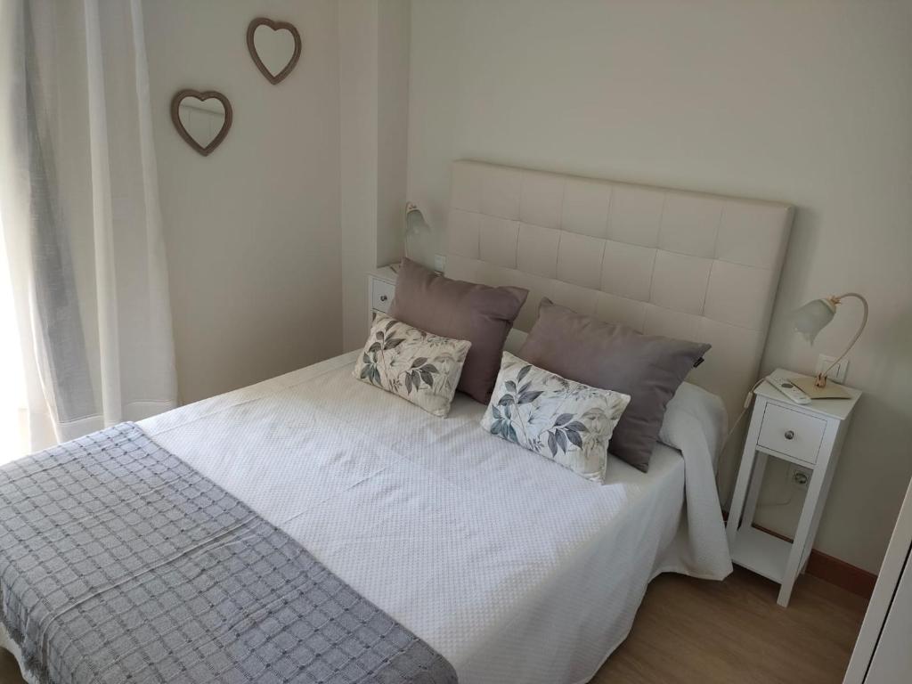 Postel nebo postele na pokoji v ubytování Apartamentos Boutique Arquera Golf I
