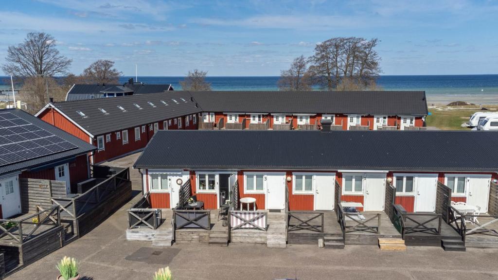 an aerial view of a building with red and white at Holiday Apartment Köpingsvik in Köpingsvik
