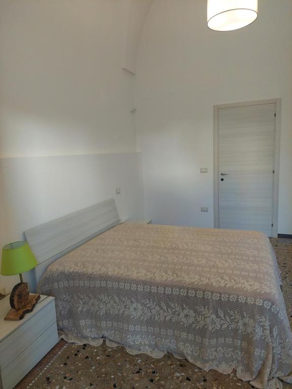 A bed or beds in a room at Casa Vacanze Lu Trappitu