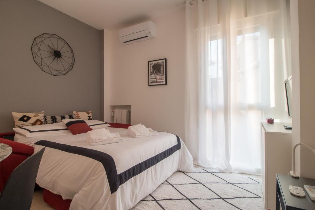 Posteľ alebo postele v izbe v ubytovaní Grey House in the heart of @Treviso