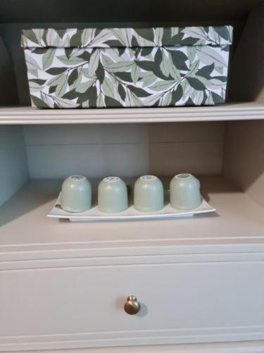 a drawer with four candles on a shelf at Résidence Océane Appartement Nature in Albi