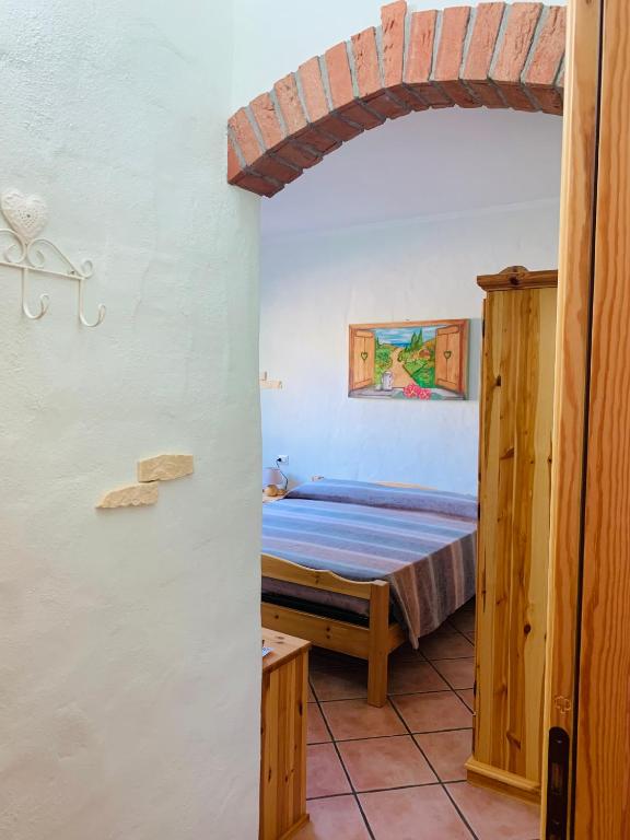 Postel nebo postele na pokoji v ubytování B&B La Baita Del Sud