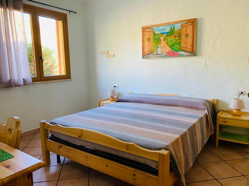Postel nebo postele na pokoji v ubytování B&B La Baita Del Sud