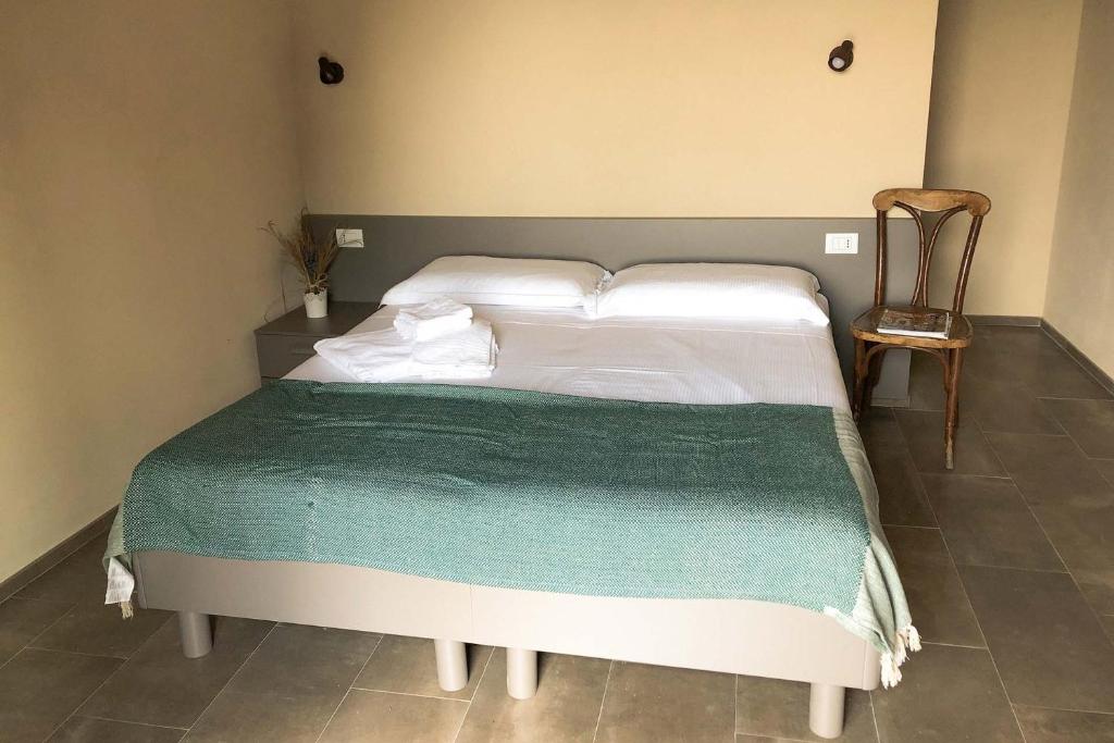 Postel nebo postele na pokoji v ubytování Agriturismo Cascina Cornelli