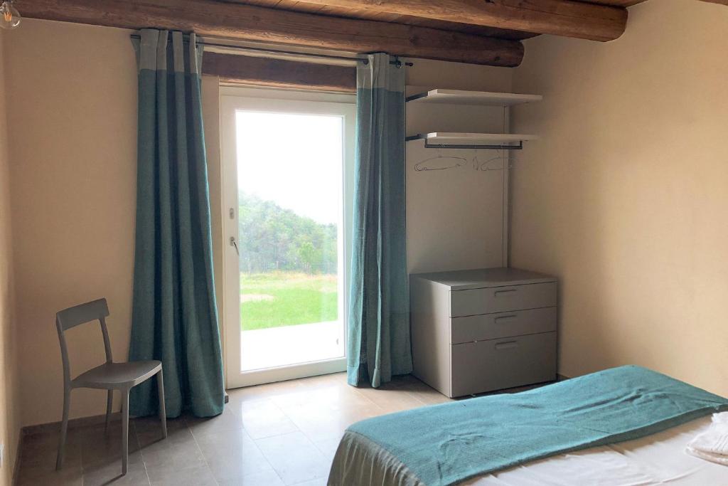 Postel nebo postele na pokoji v ubytování Agriturismo Cascina Cornelli