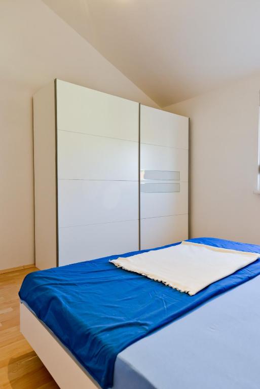 Posteľ alebo postele v izbe v ubytovaní Apartmani Vidikovac Dokoza