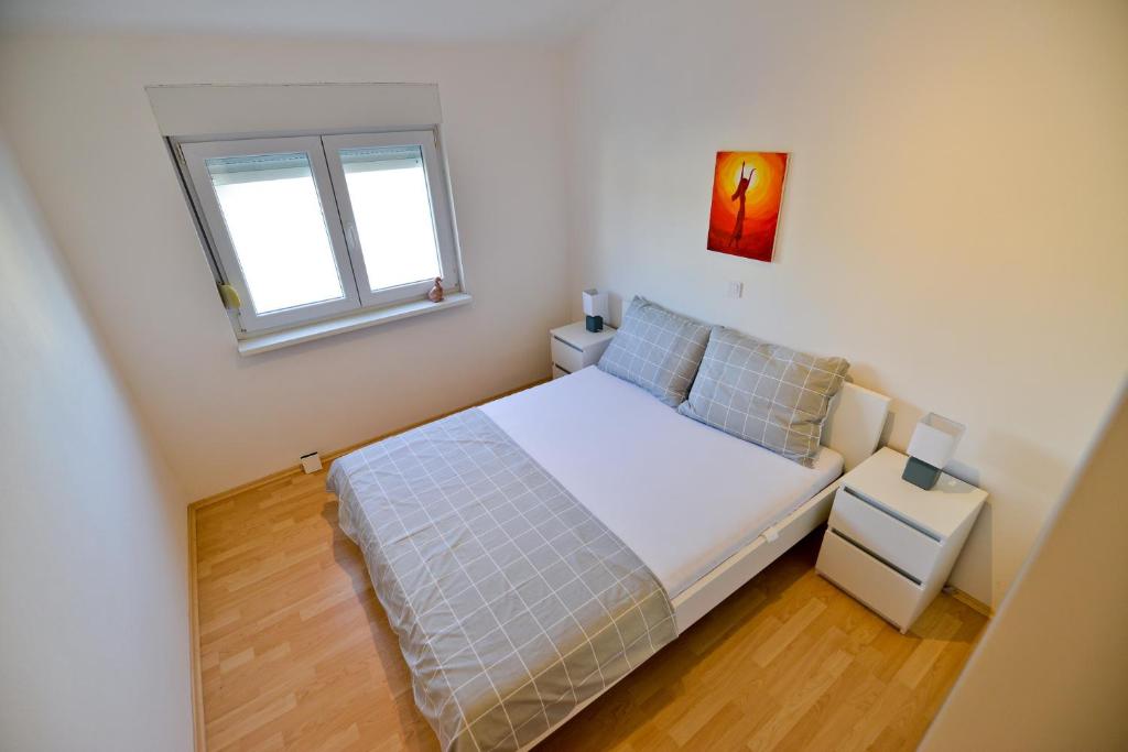 Posteľ alebo postele v izbe v ubytovaní Apartmani Vidikovac Dokoza