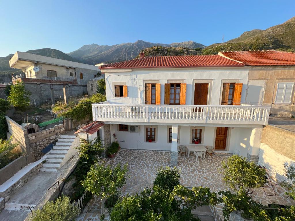an aerial view of a white house with a balcony at Emilios Traditional Villa in Dhërmi