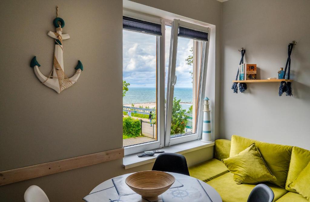 a living room with a view of the ocean at Apartament z widokiem na morze u Grażyny 3 in Jarosławiec